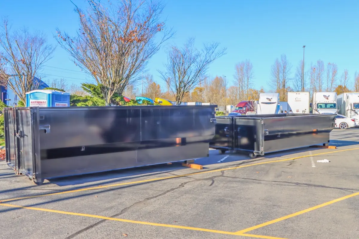 Professional dumpster rental service with roll-off container on residential driveway in South Pasadena